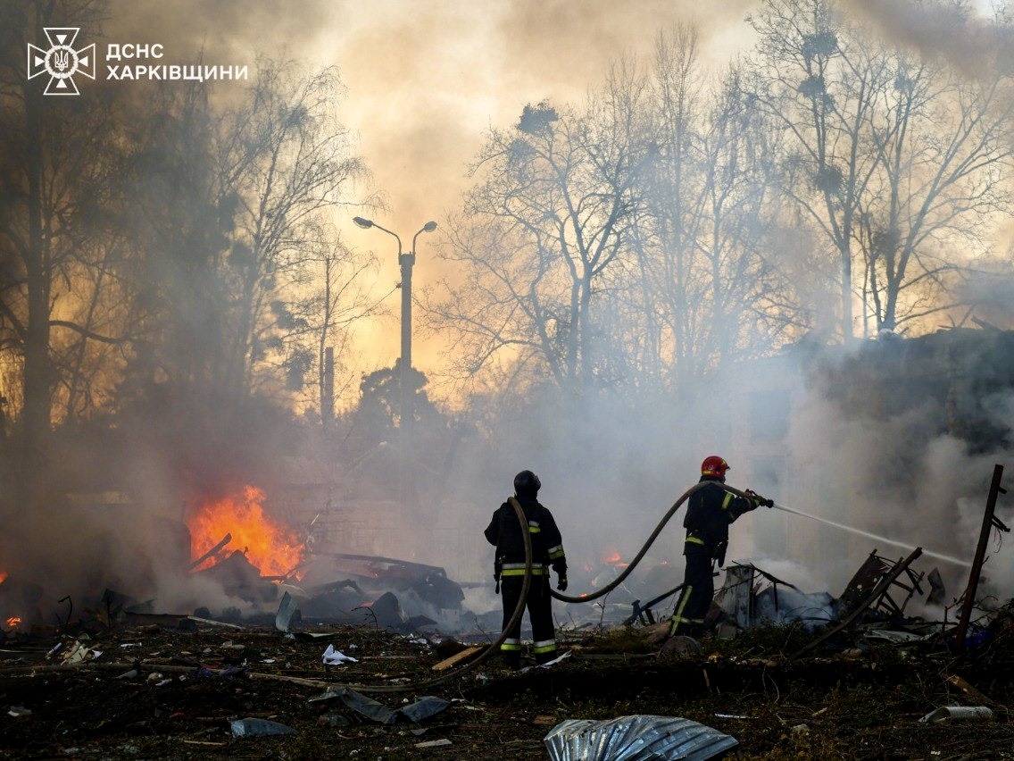 The Ukrainian Red Cross assists victims at the site of a rocket attack ...