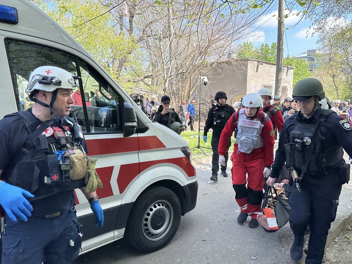 The Ukrainian Red Cross assists at the scene of the attack in ...